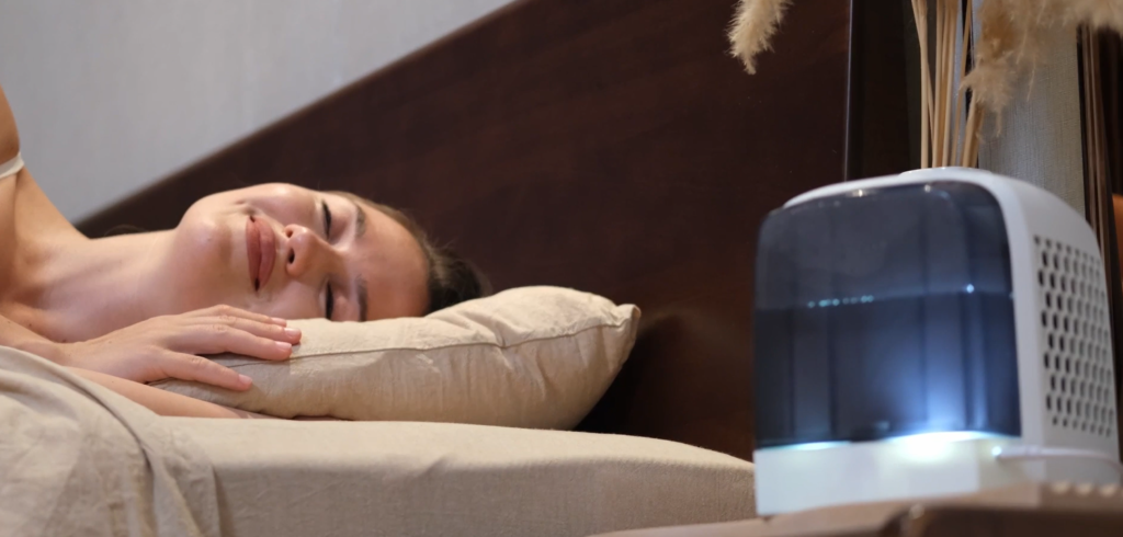 Image of woman sleeping next to a Polar Cooling device